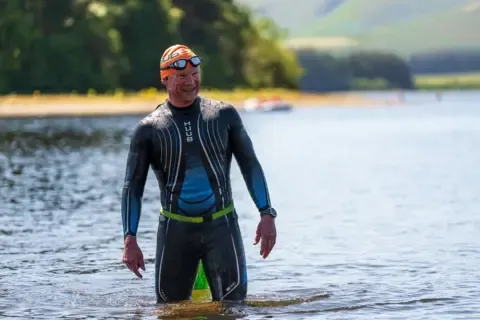 Each Week, He Goes Back to the Waters In Which His Wife Died